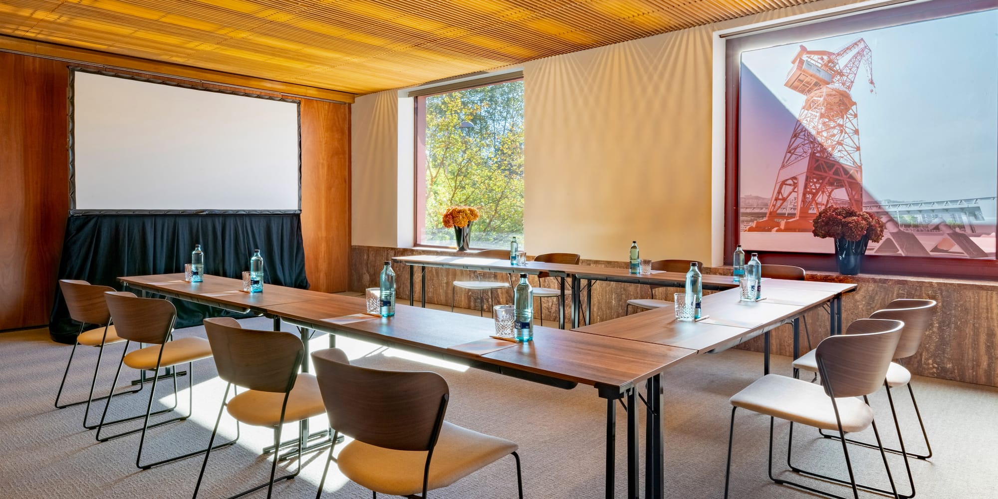 a room with a large table and chairs