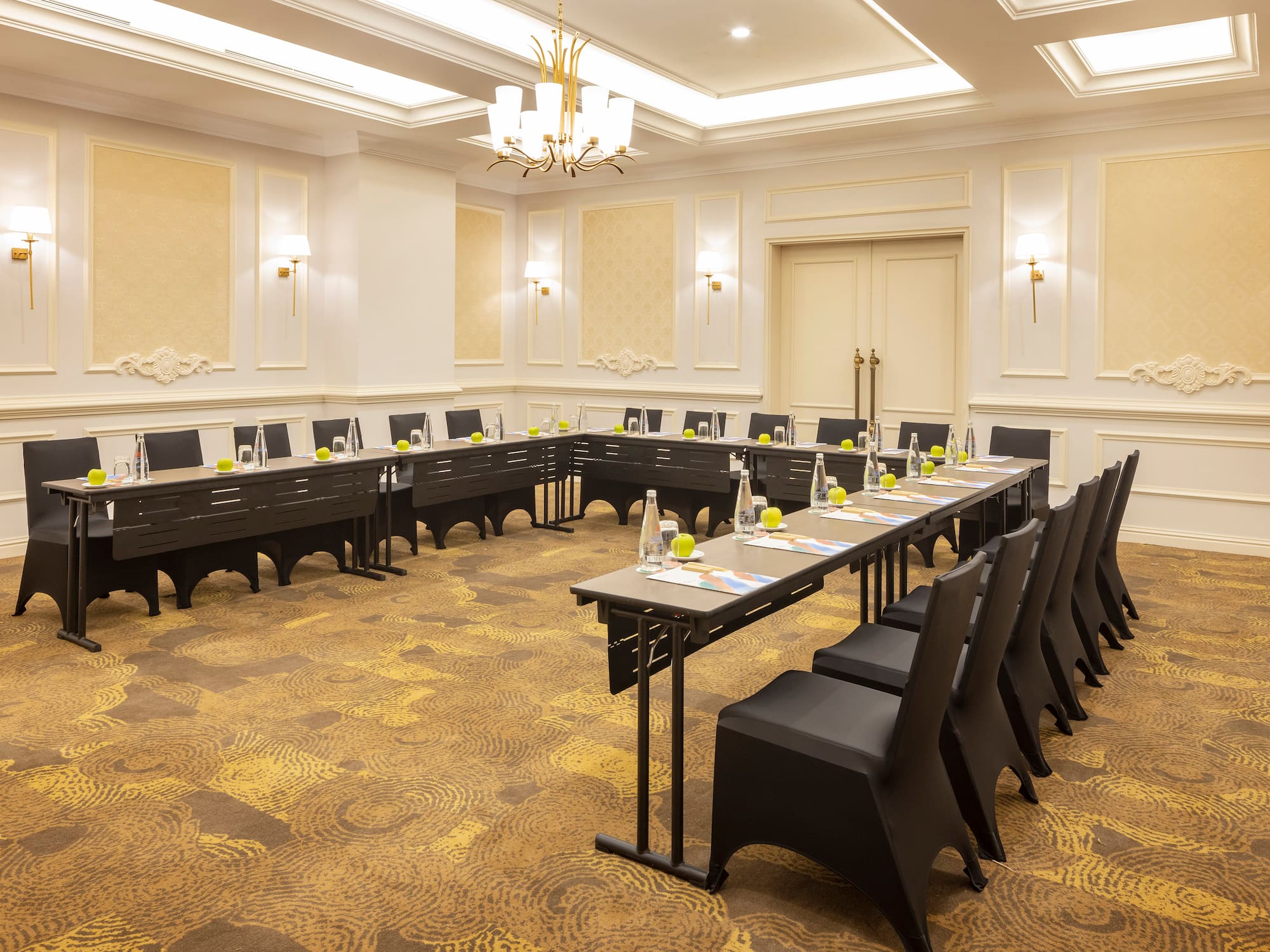 a room with long tables and chairs