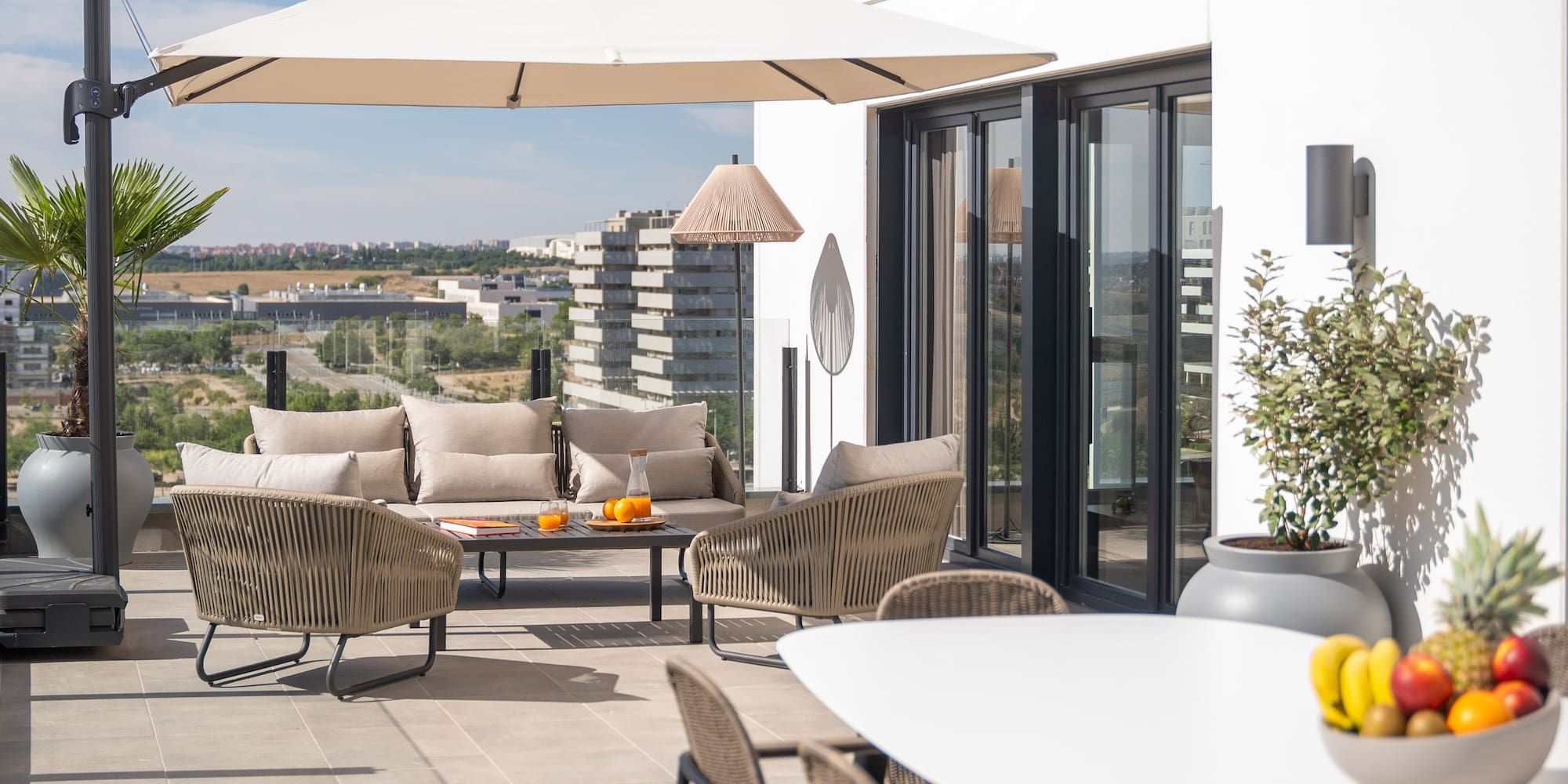 a patio with a table and chairs