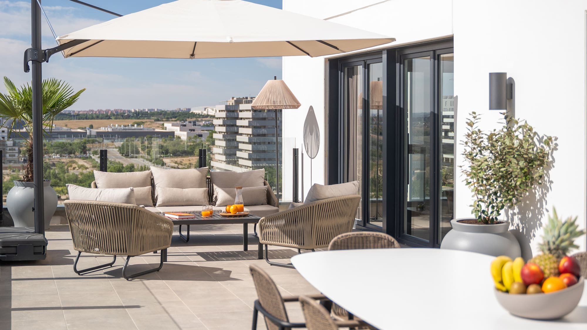 a patio with a table and chairs
