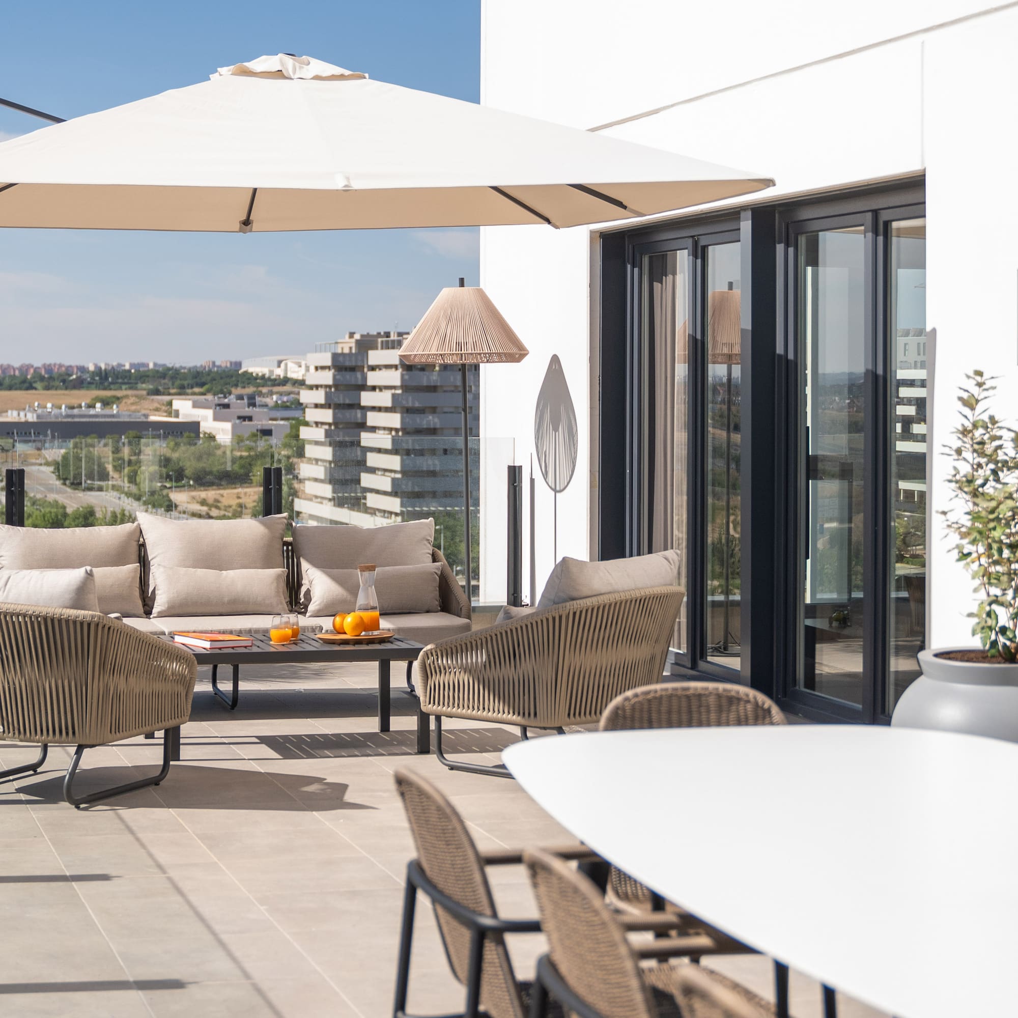 a patio with a table and chairs