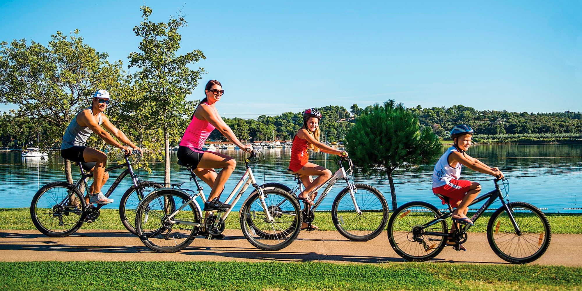 a group of people riding bicycles