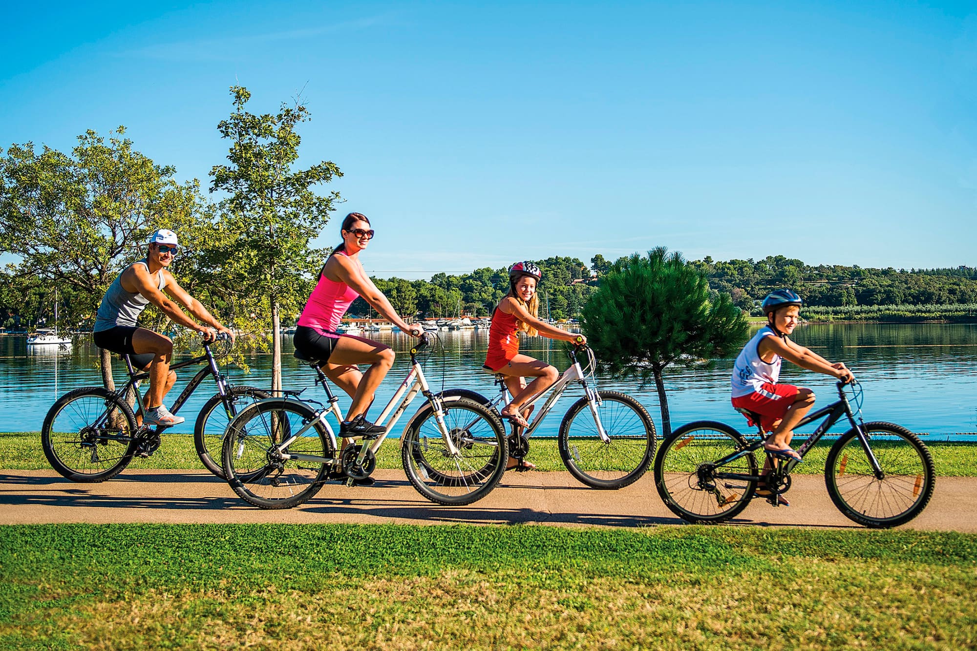a group of people riding bicycles