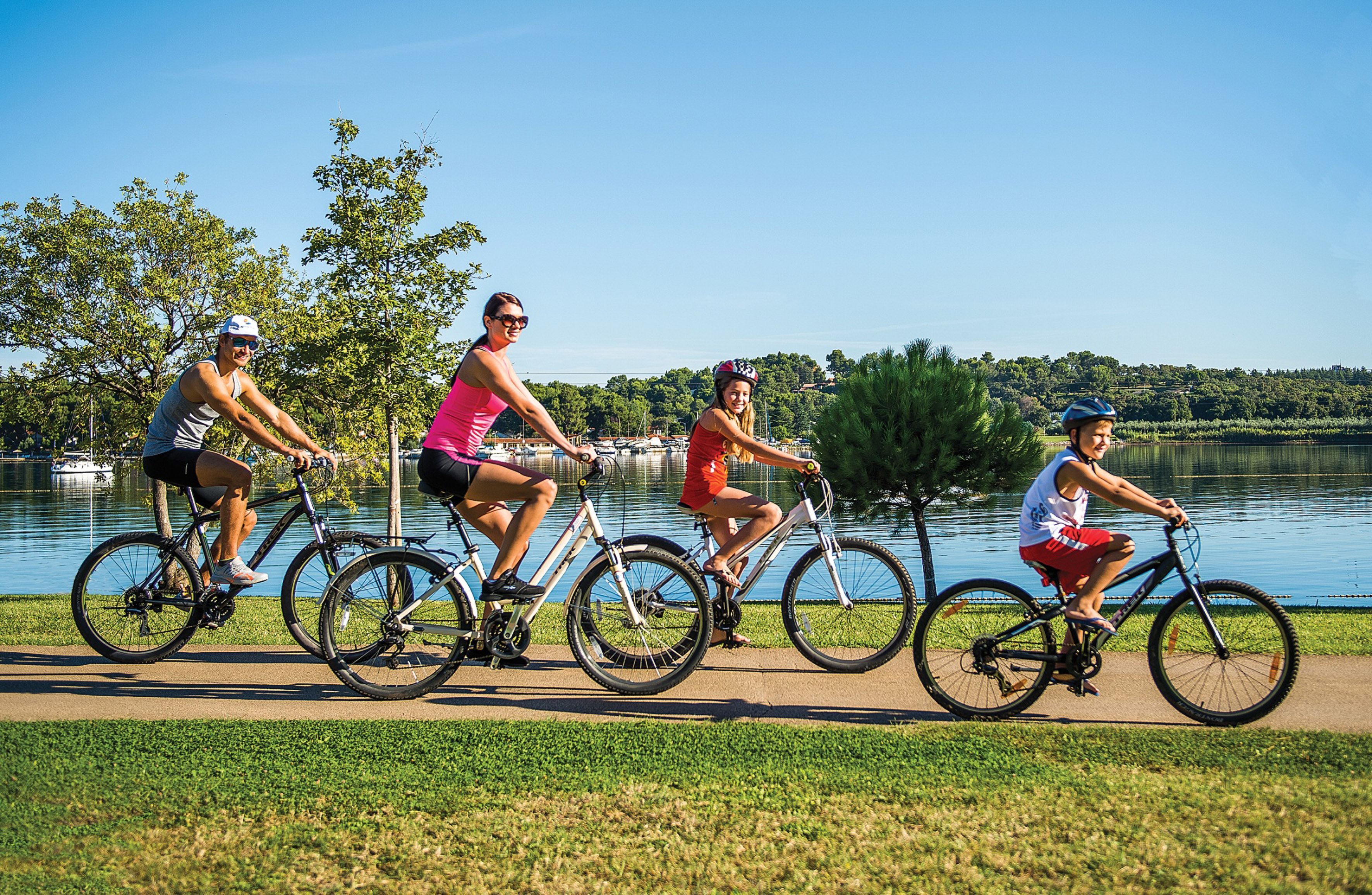 a group of people riding bicycles