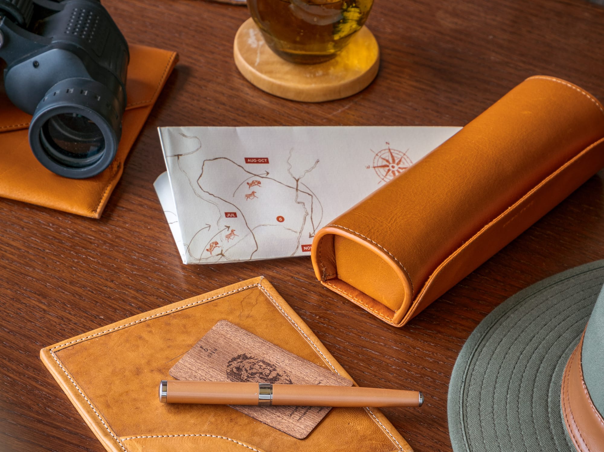 a pen and glasses on a table