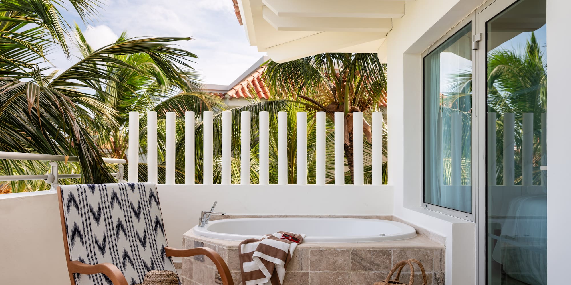 a chair and a bathtub on a patio