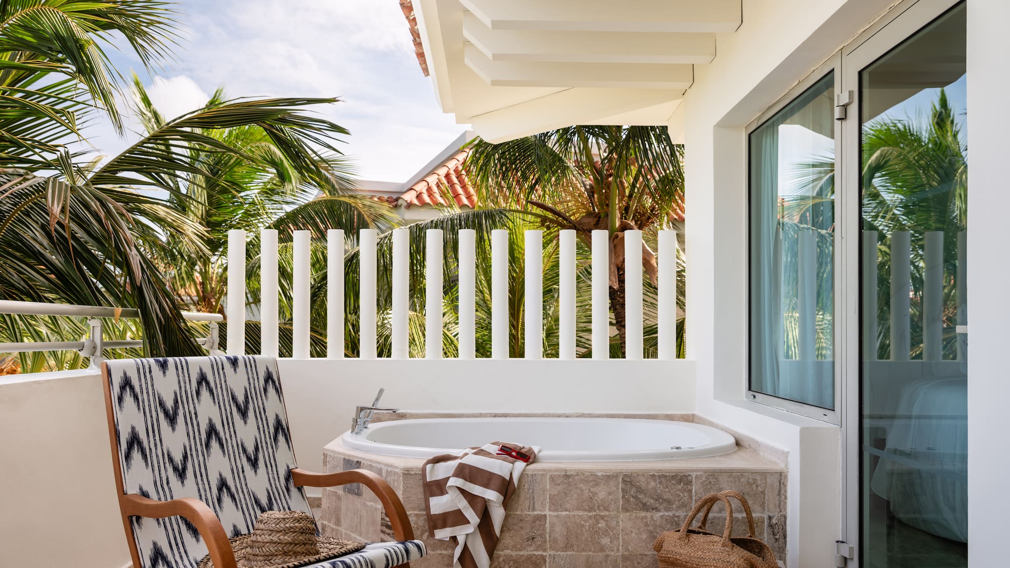 a chair and a bathtub on a patio