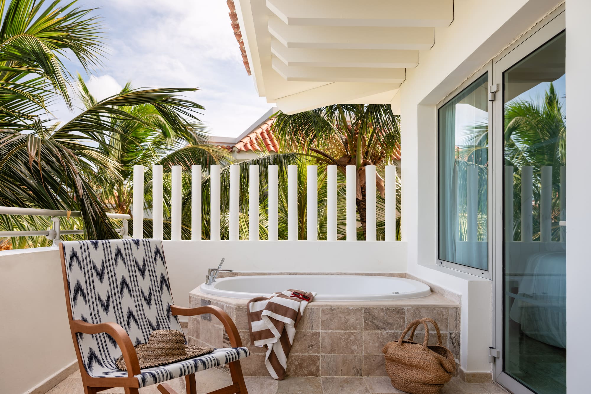 a chair and a bathtub on a patio