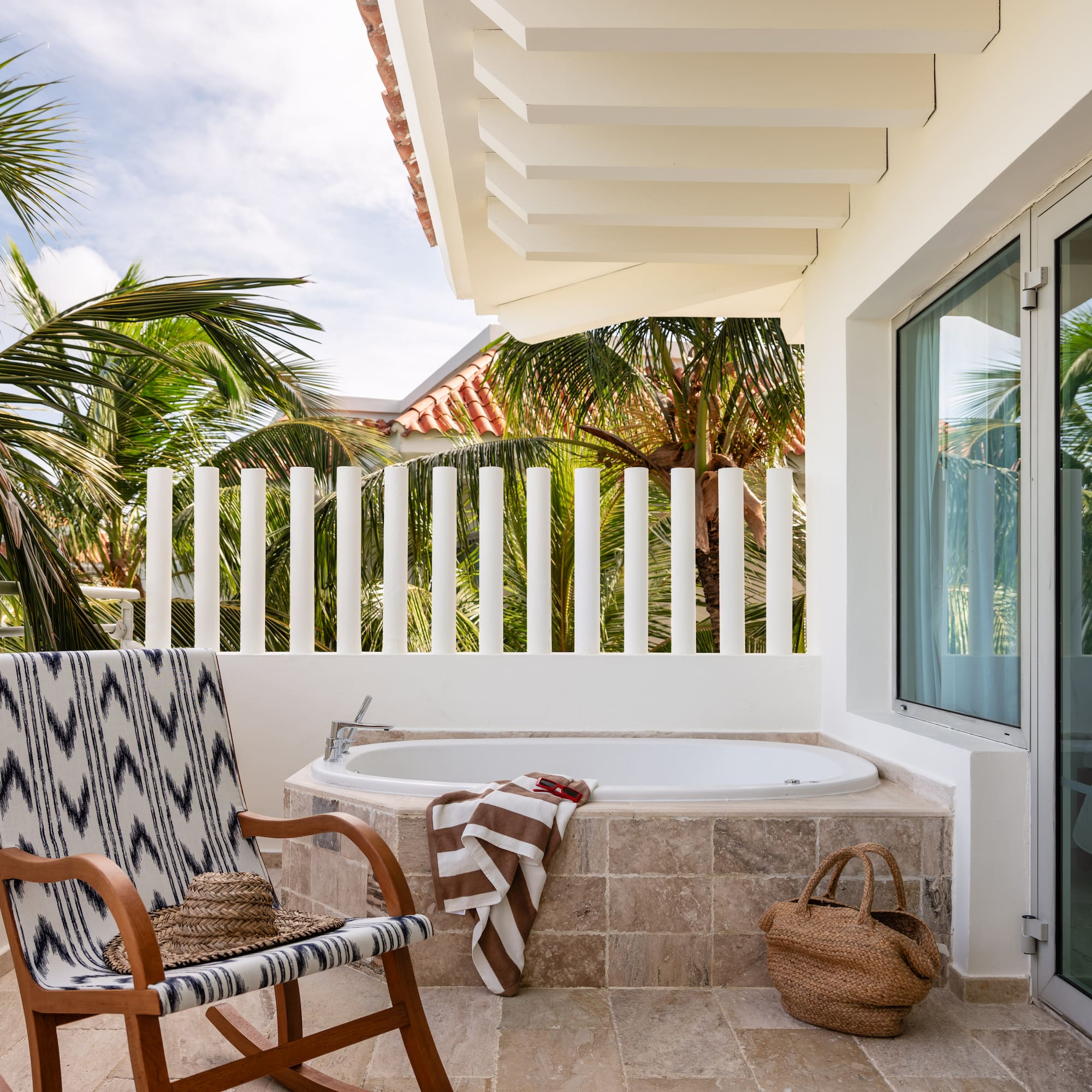 a chair and a bathtub on a patio