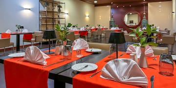 a restaurant with tables and chairs