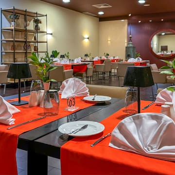 a restaurant with tables and chairs