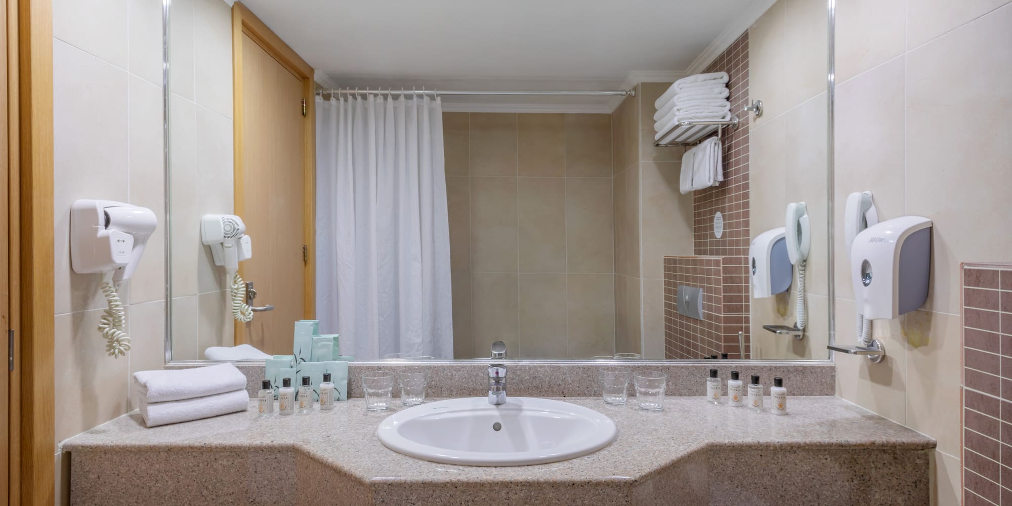 a bathroom with a sink and mirror