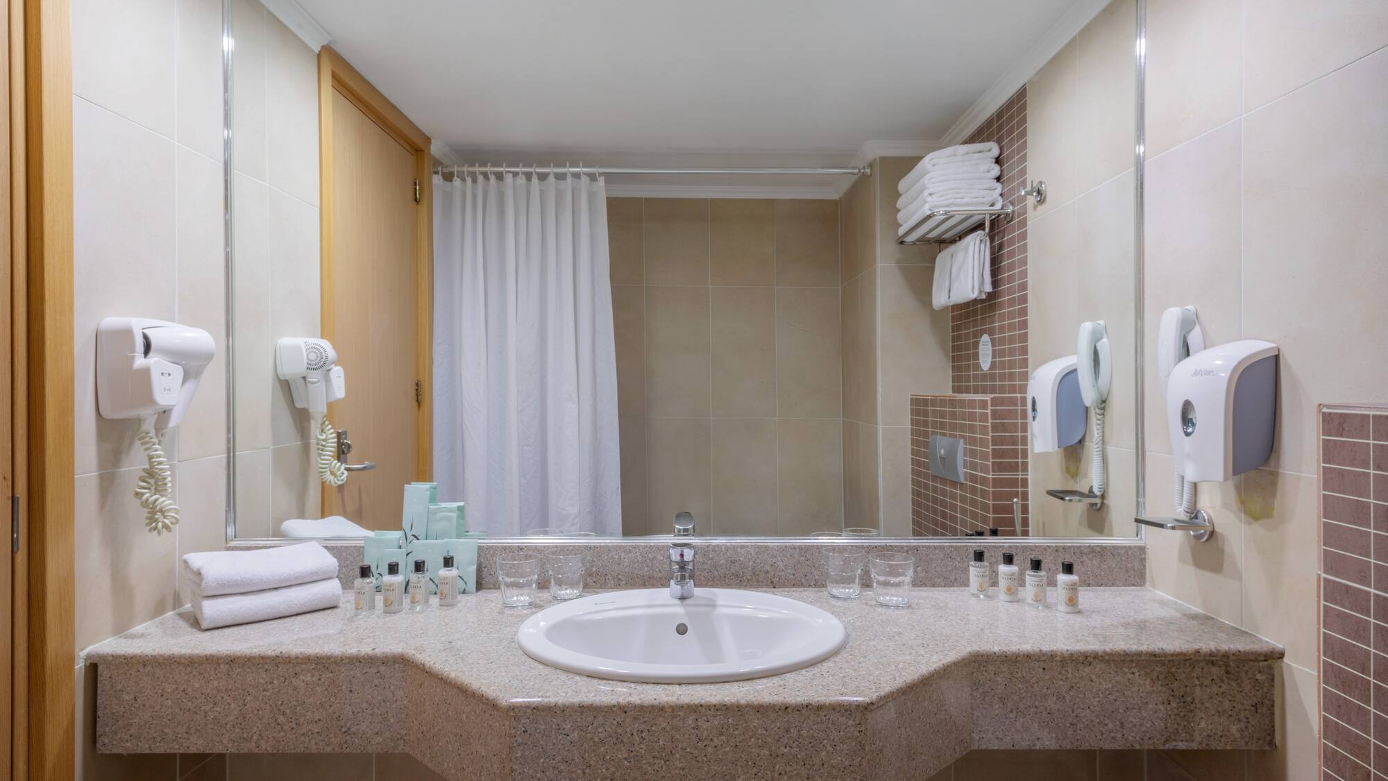 a bathroom with a sink and mirror