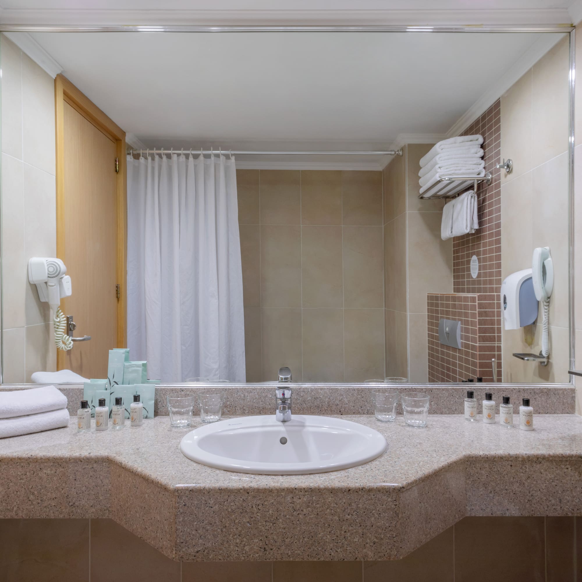 a bathroom with a sink and mirror