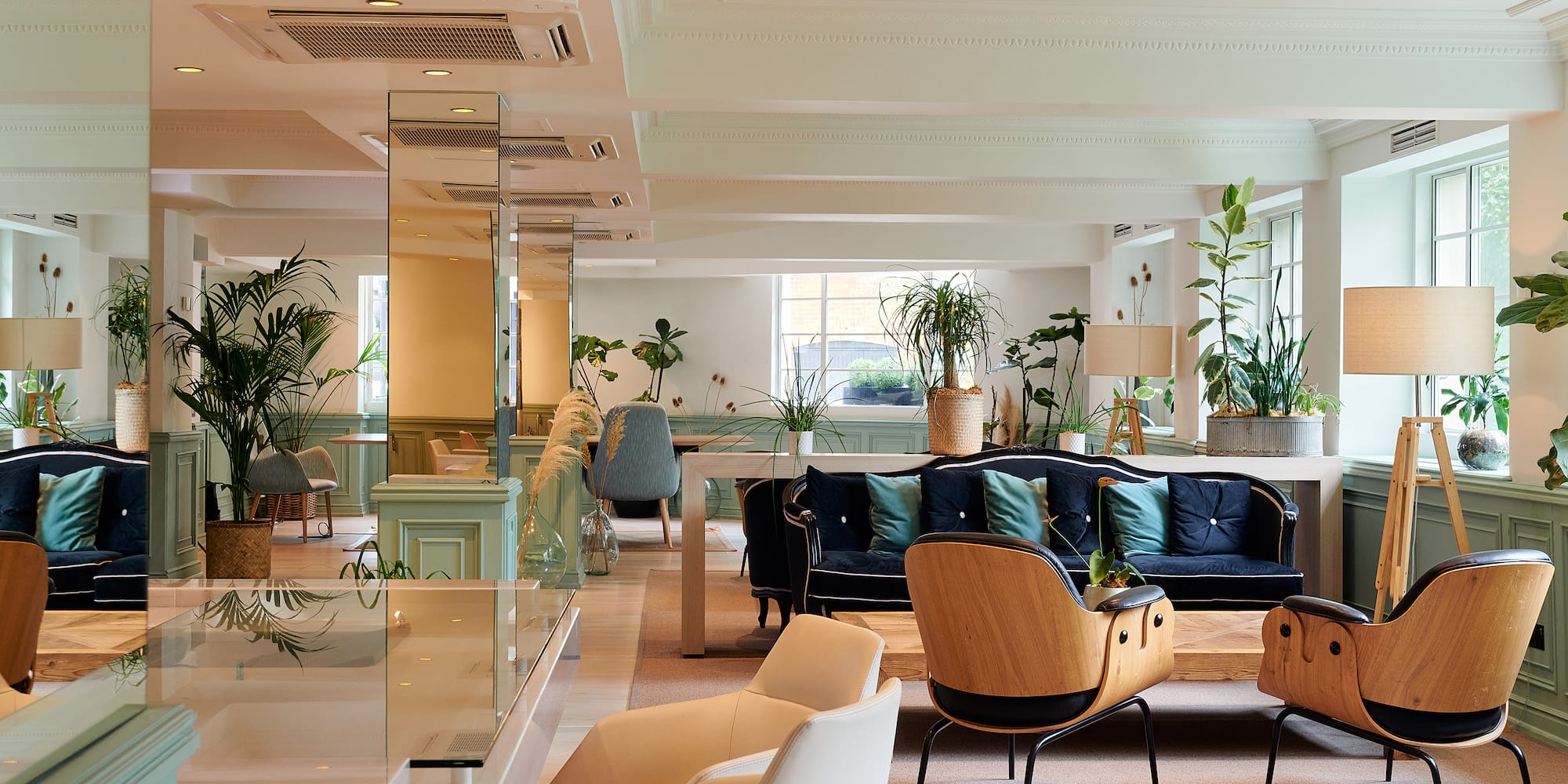 a room with a couch and chairs