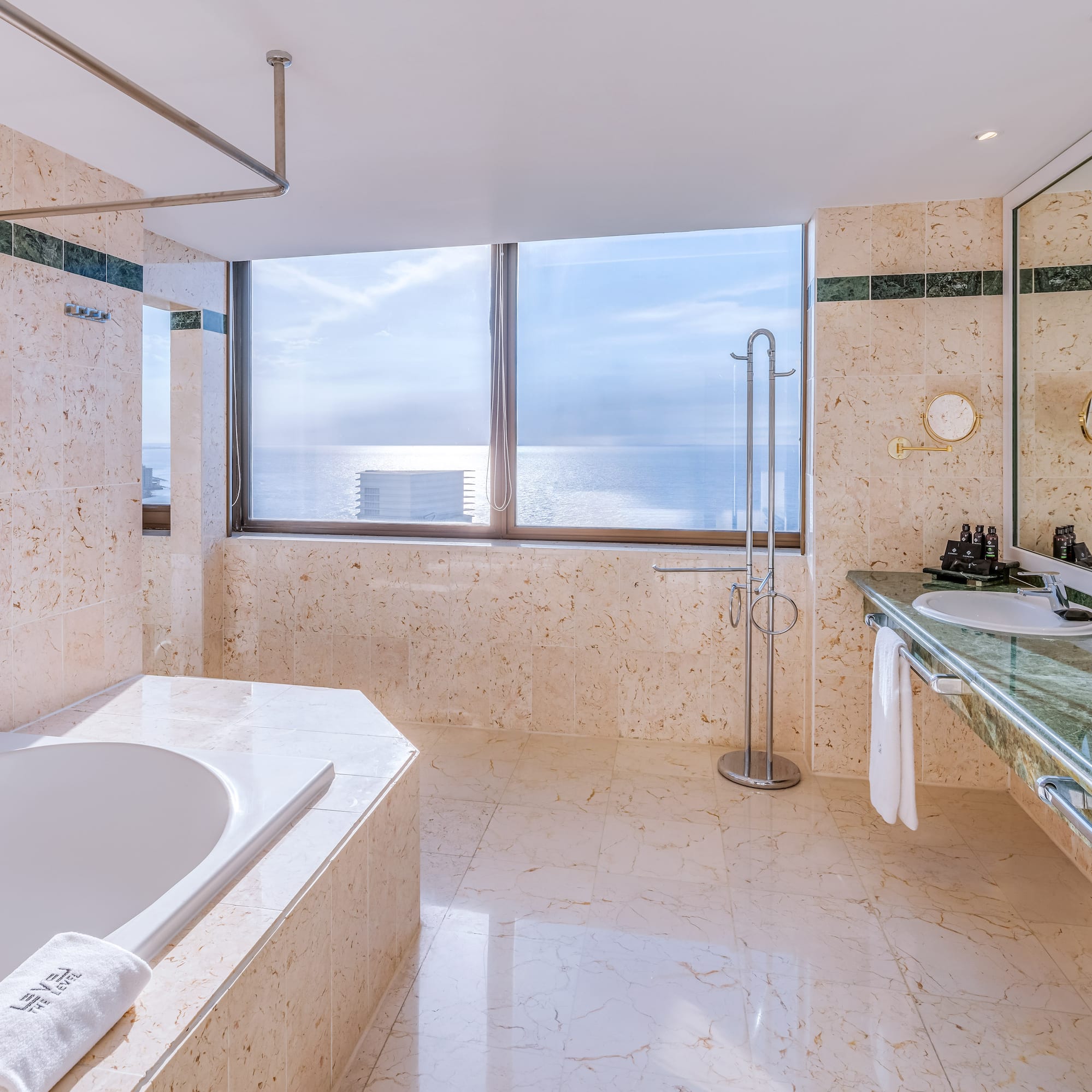 a bathroom with a tub and sink