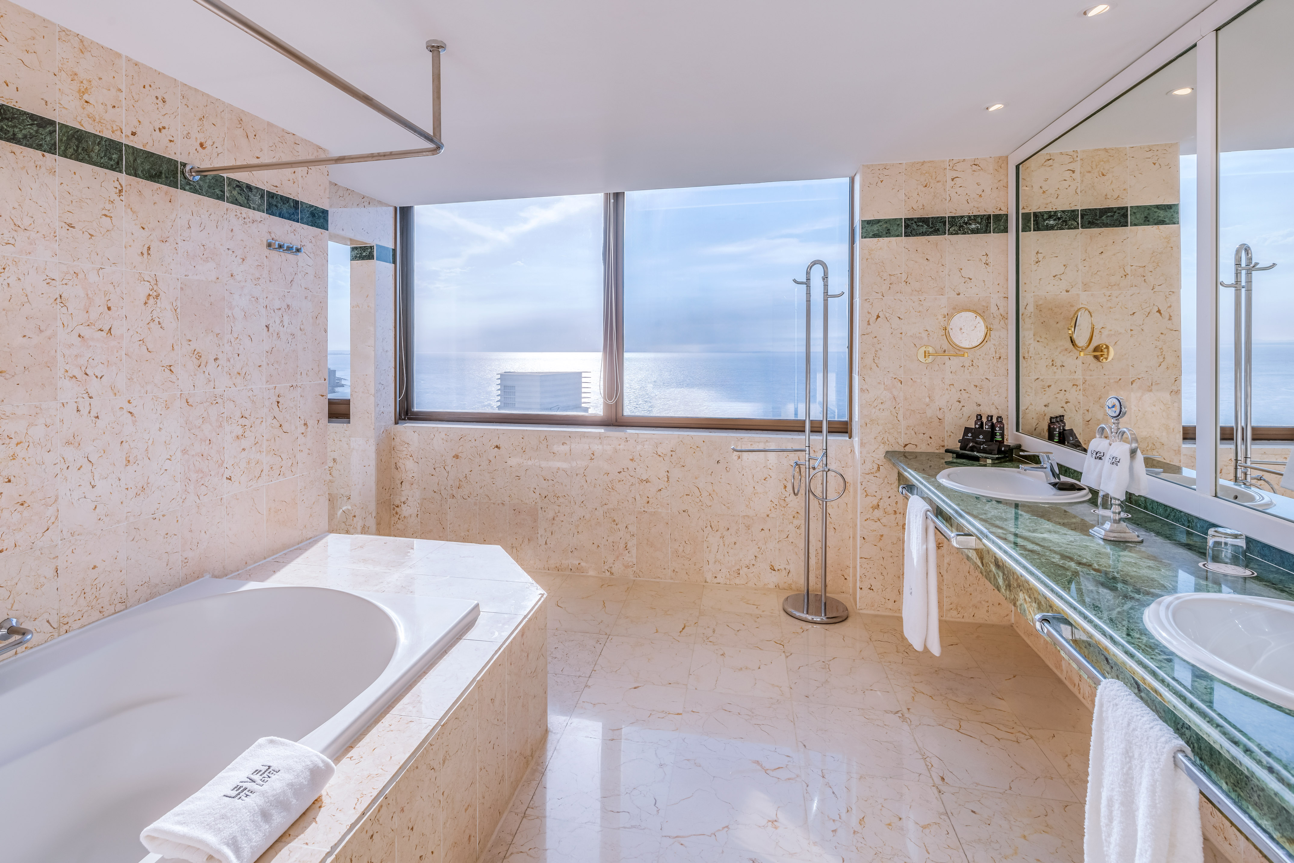 a bathroom with a tub and sink
