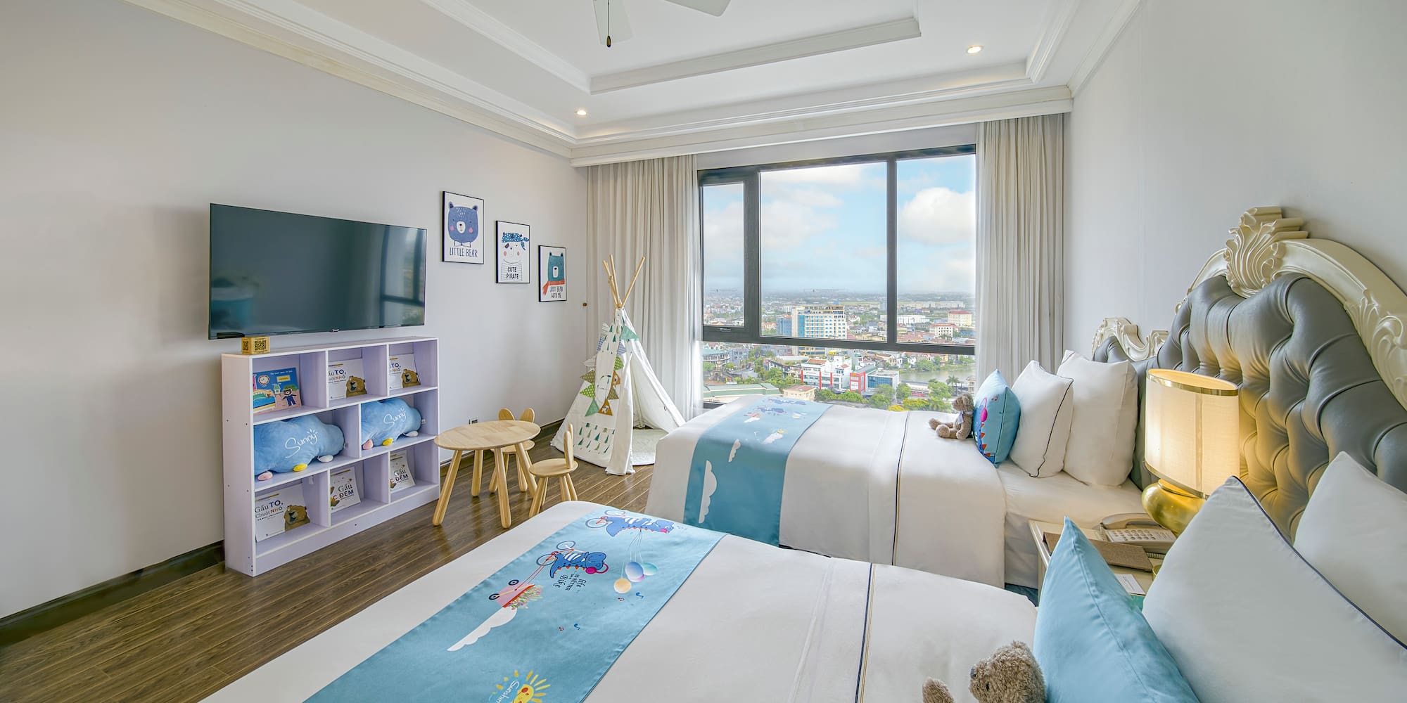 a bedroom with two beds and a window