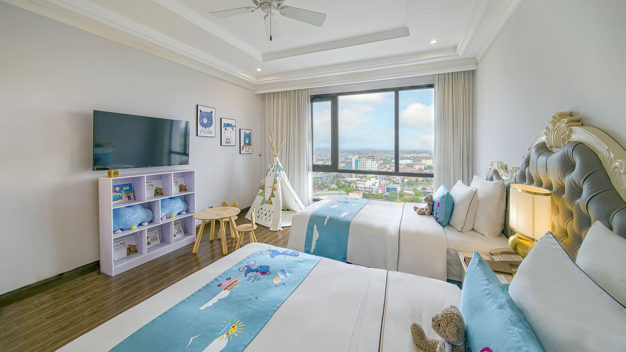 a bedroom with two beds and a window