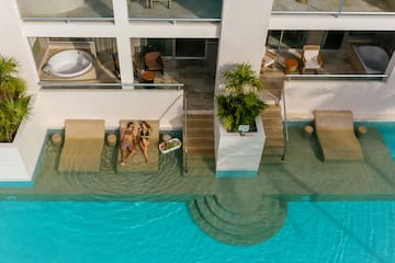 a couple of people sitting on a pool