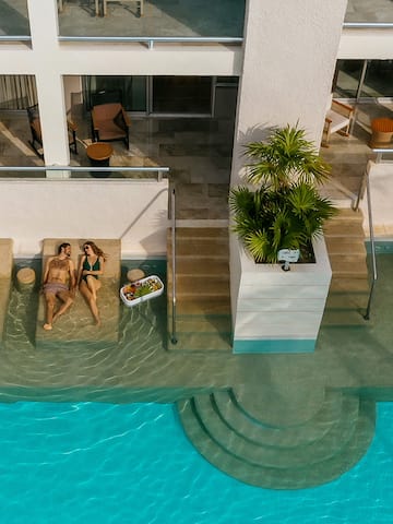 a couple of people sitting on a pool