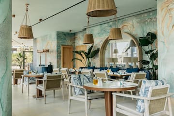 a restaurant with tables and chairs