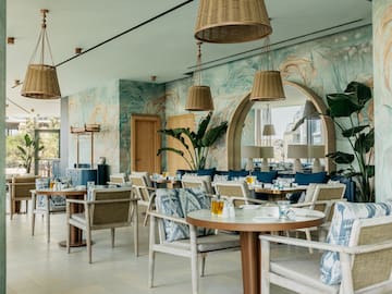 a restaurant with tables and chairs