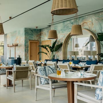 a restaurant with tables and chairs