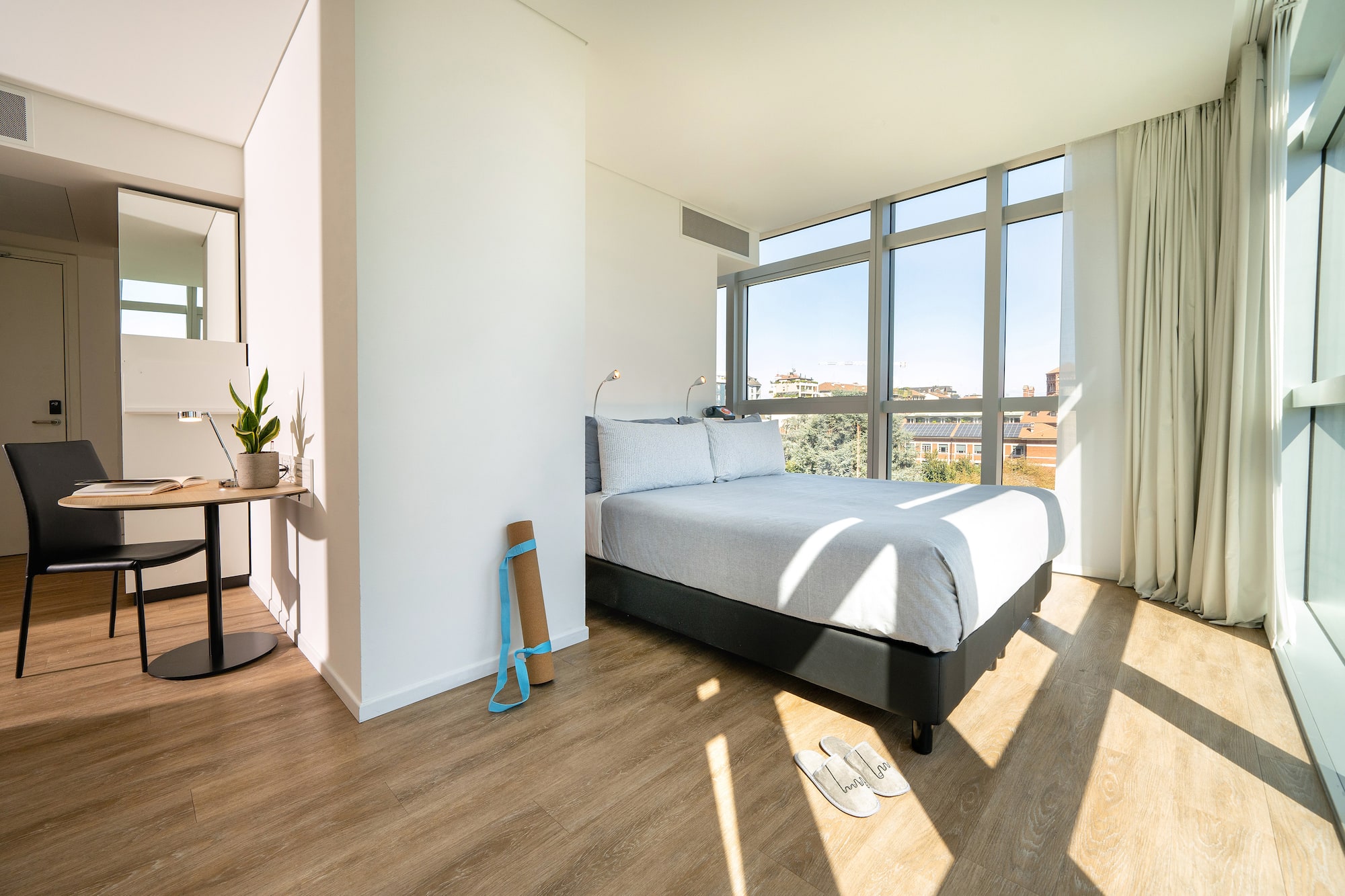 a bedroom with a bed and a window