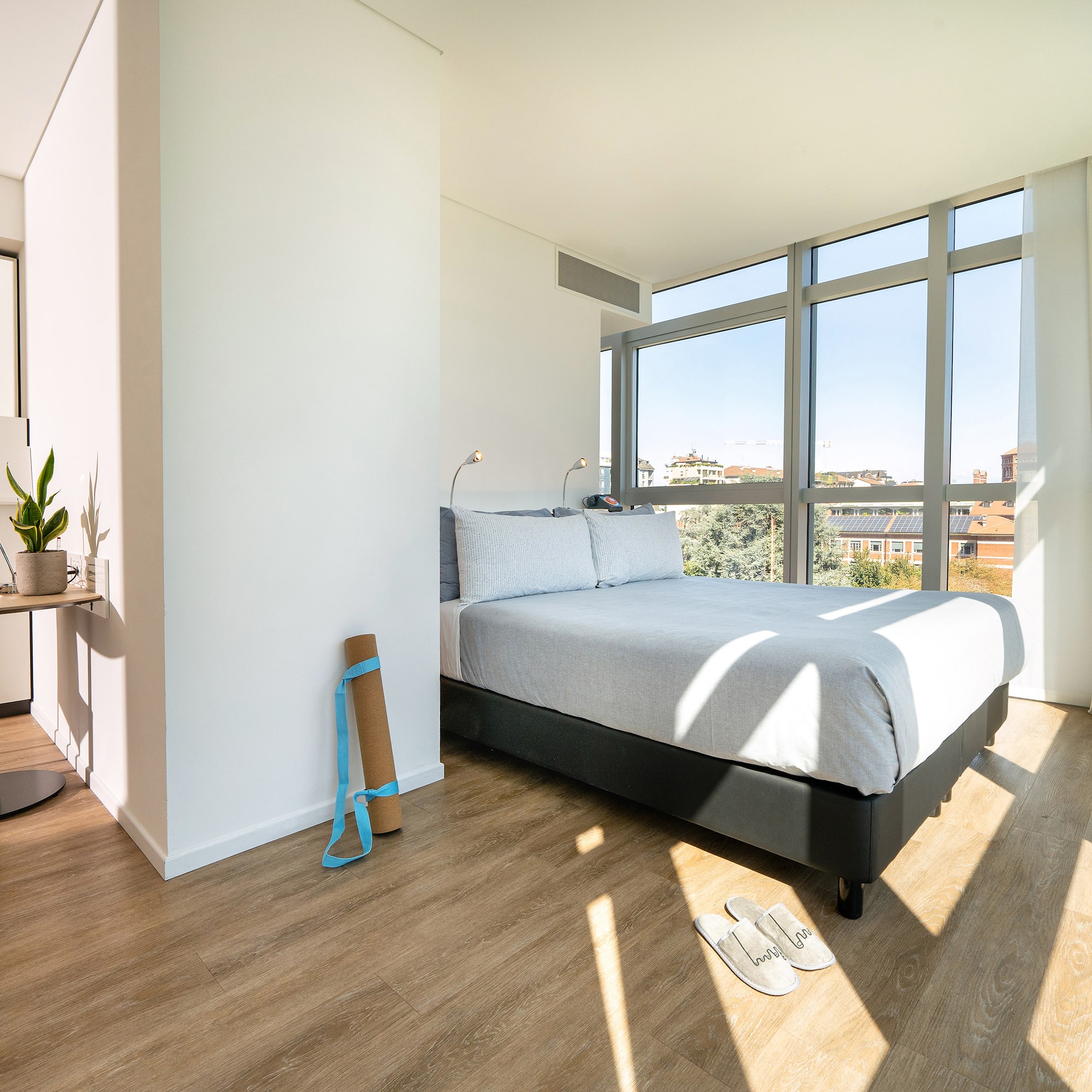 a bedroom with a bed and a window