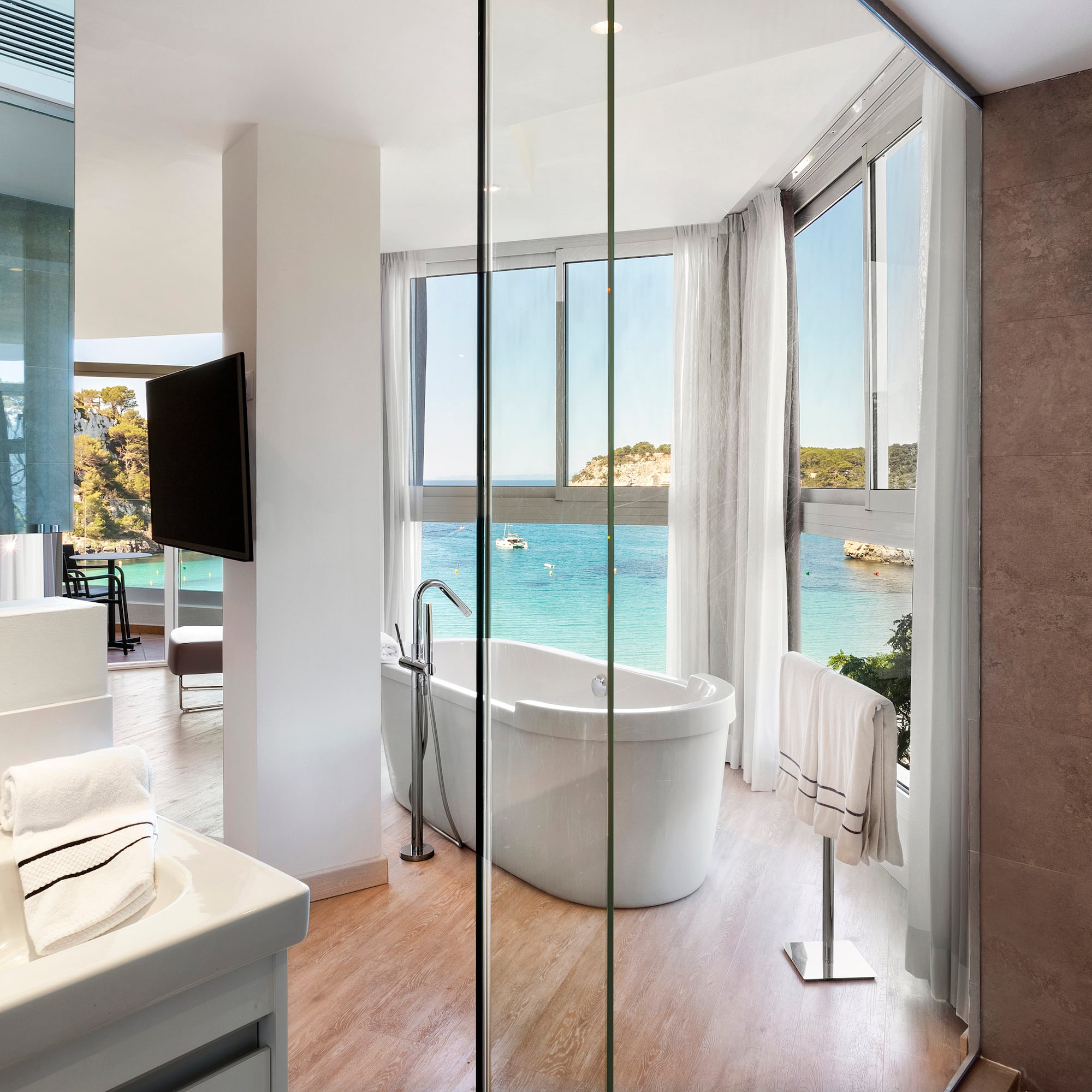 a bathroom with a tub and a sink