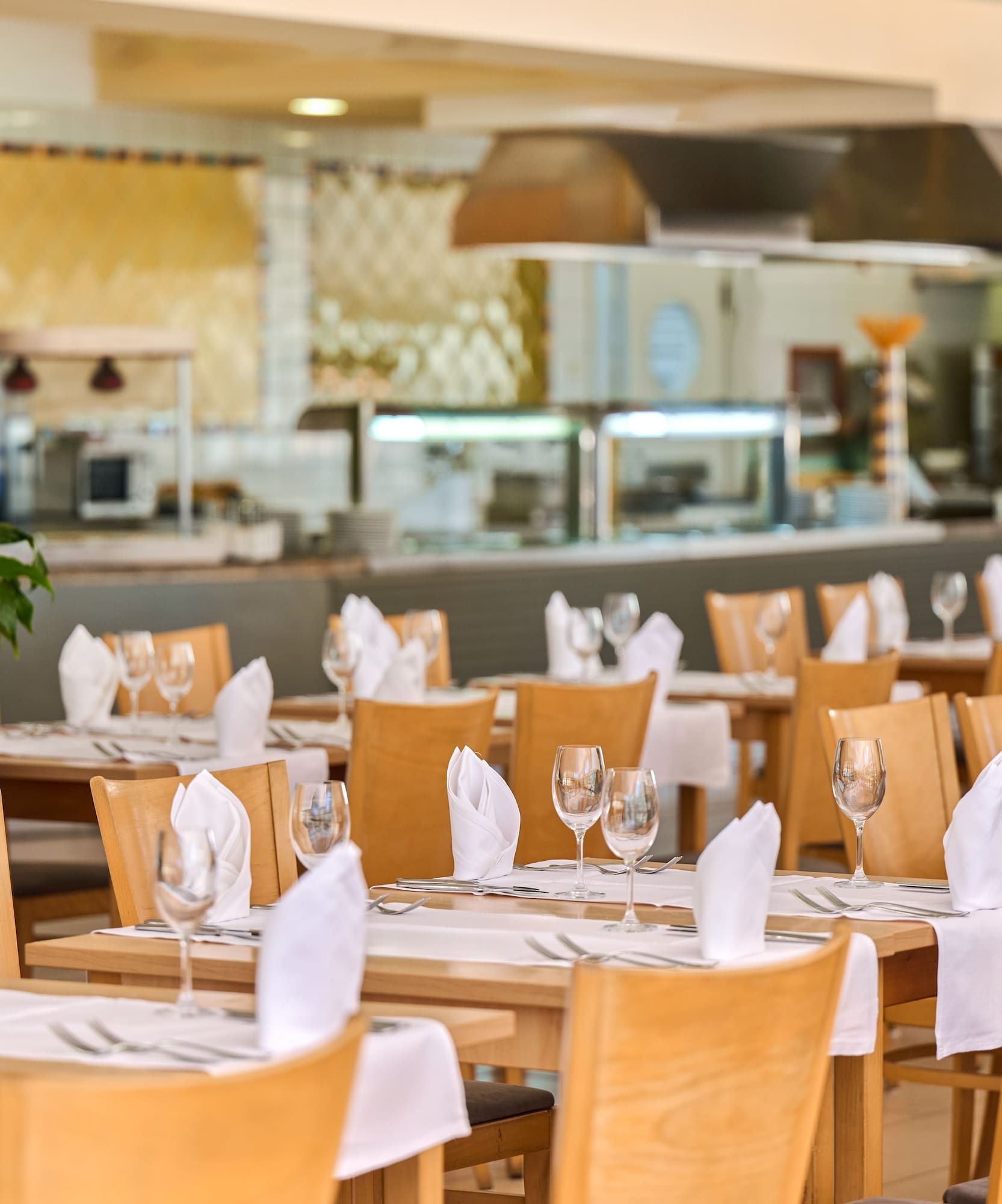 a restaurant with tables and chairs