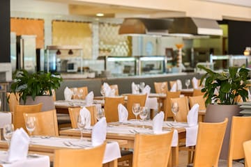 a restaurant with tables and chairs