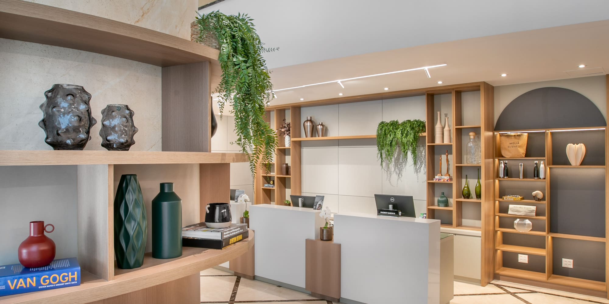 a room with a desk and shelves