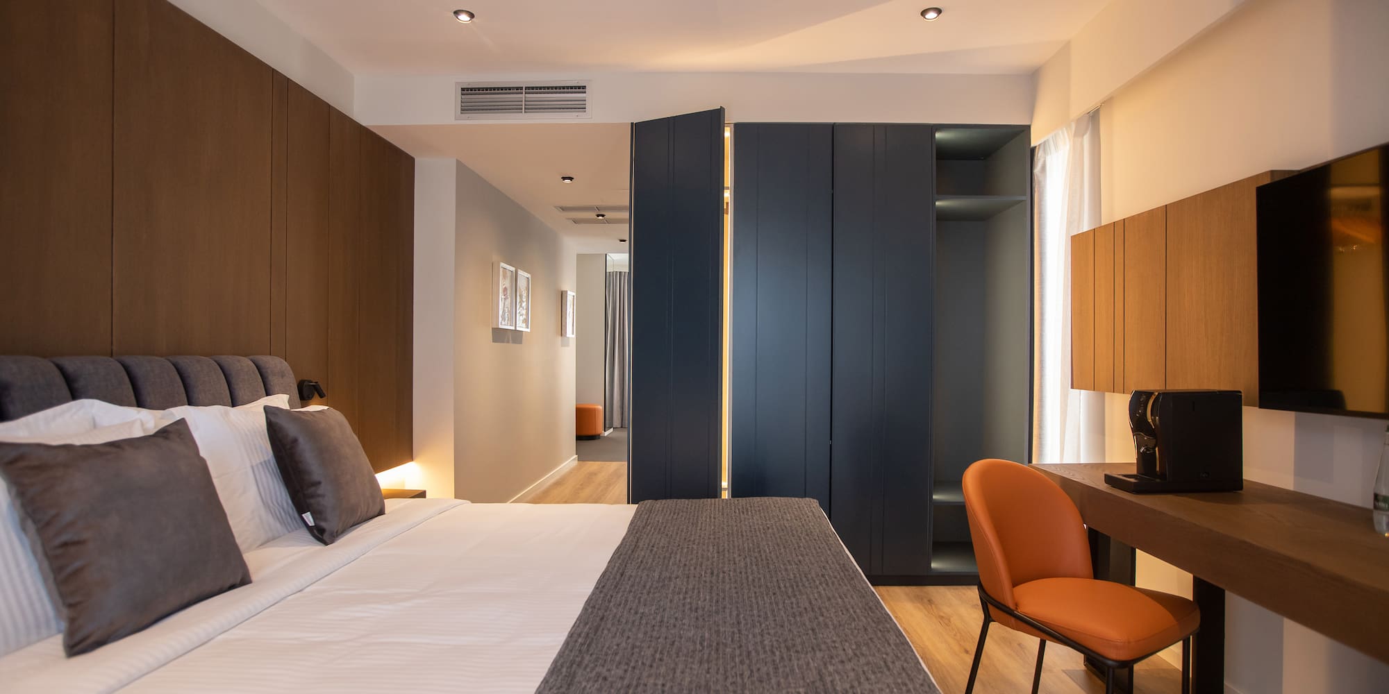 a room with a bed and a desk