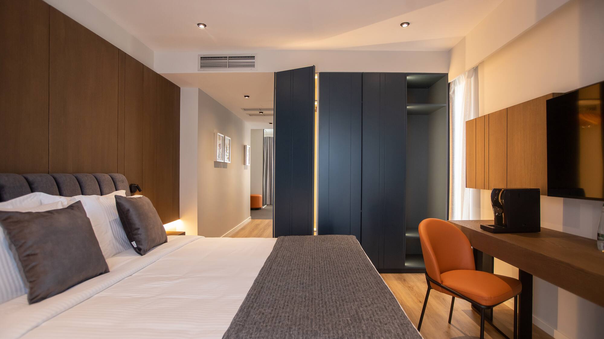 a room with a bed and a desk