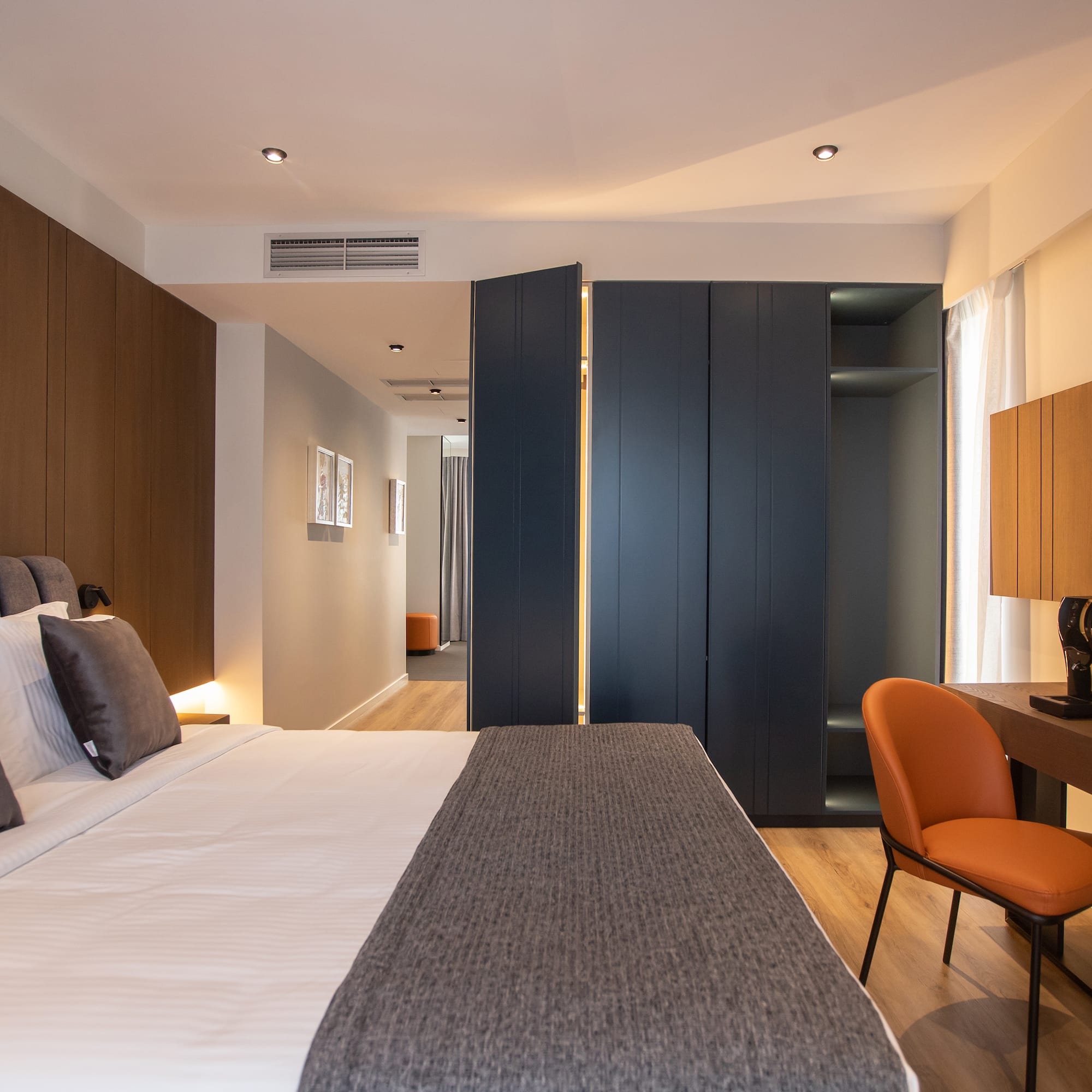 a room with a bed and a desk