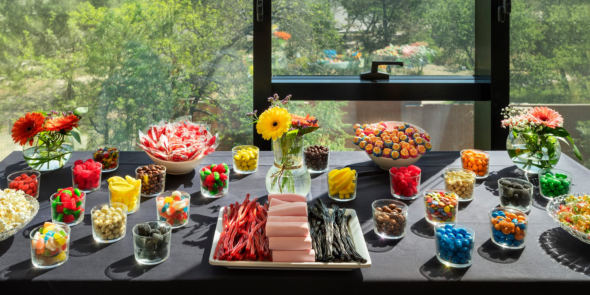a table with different colored candies