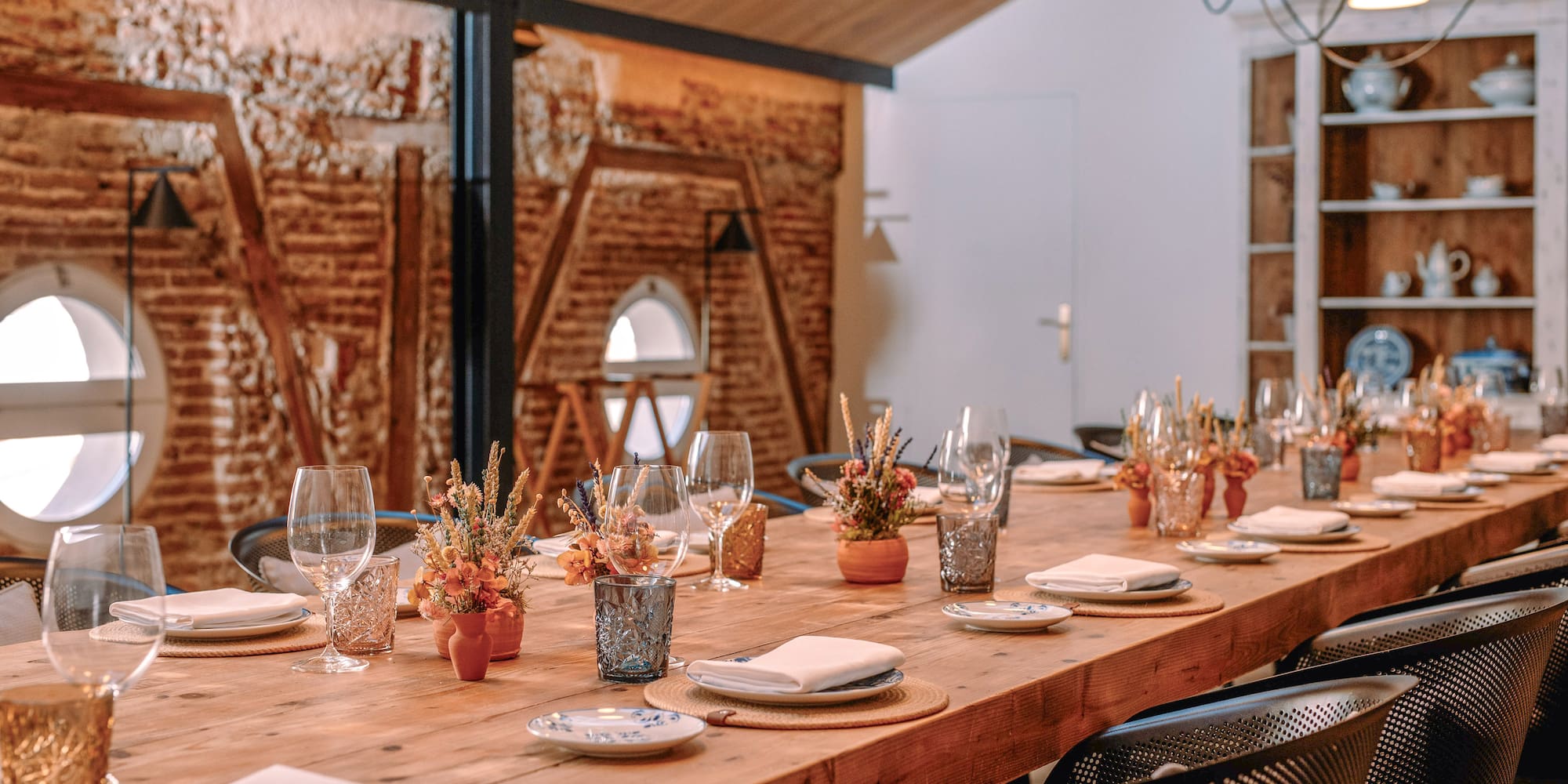 a room with a brick wall and a door