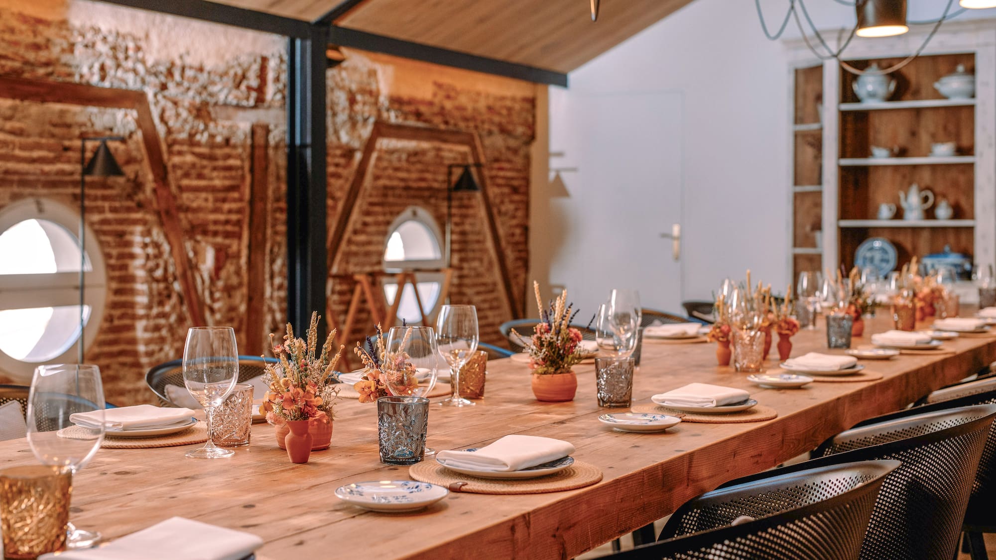 a room with a brick wall and a door