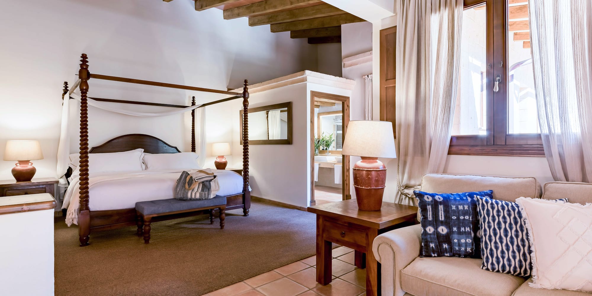 a bedroom with a bed and a couch