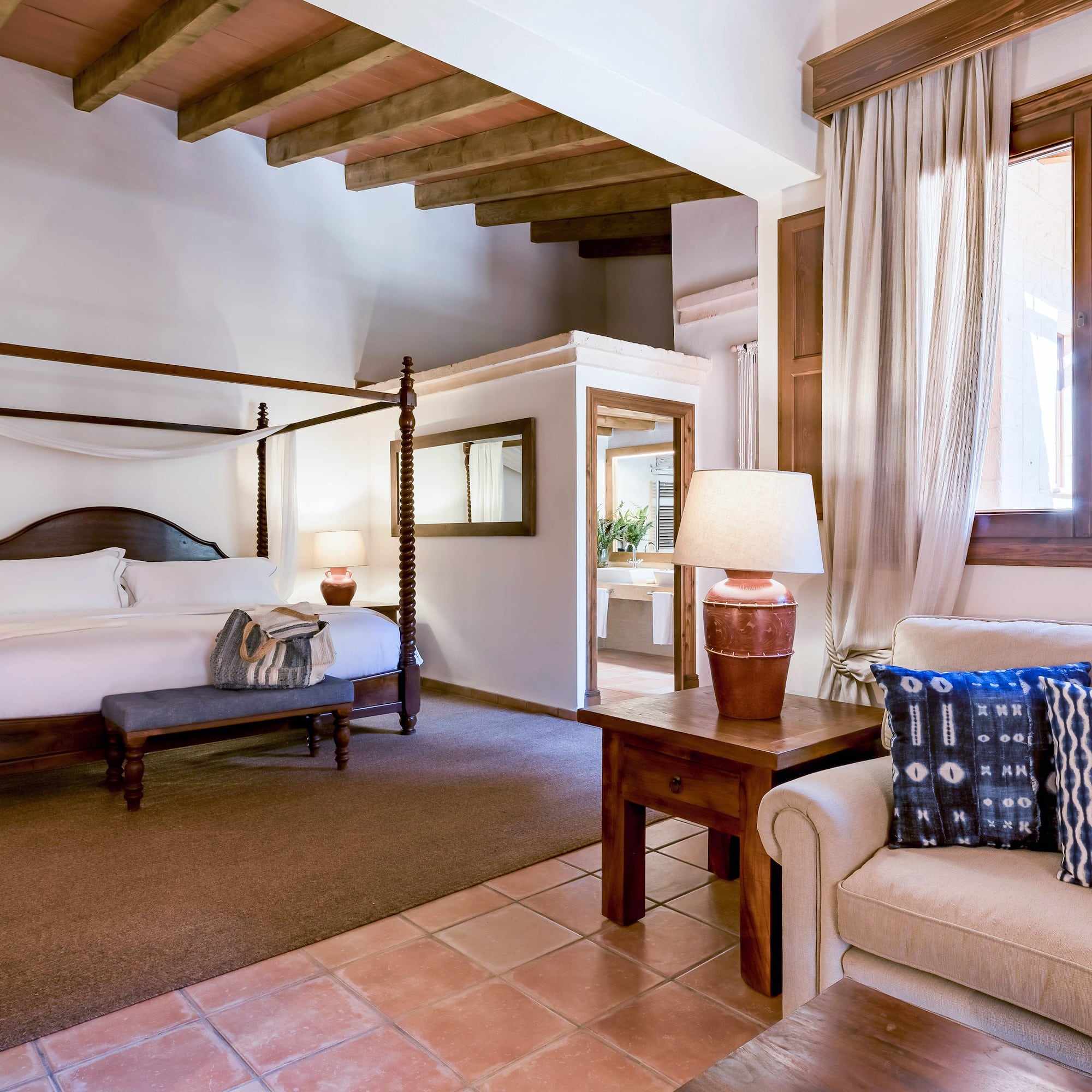 a bedroom with a bed and a couch