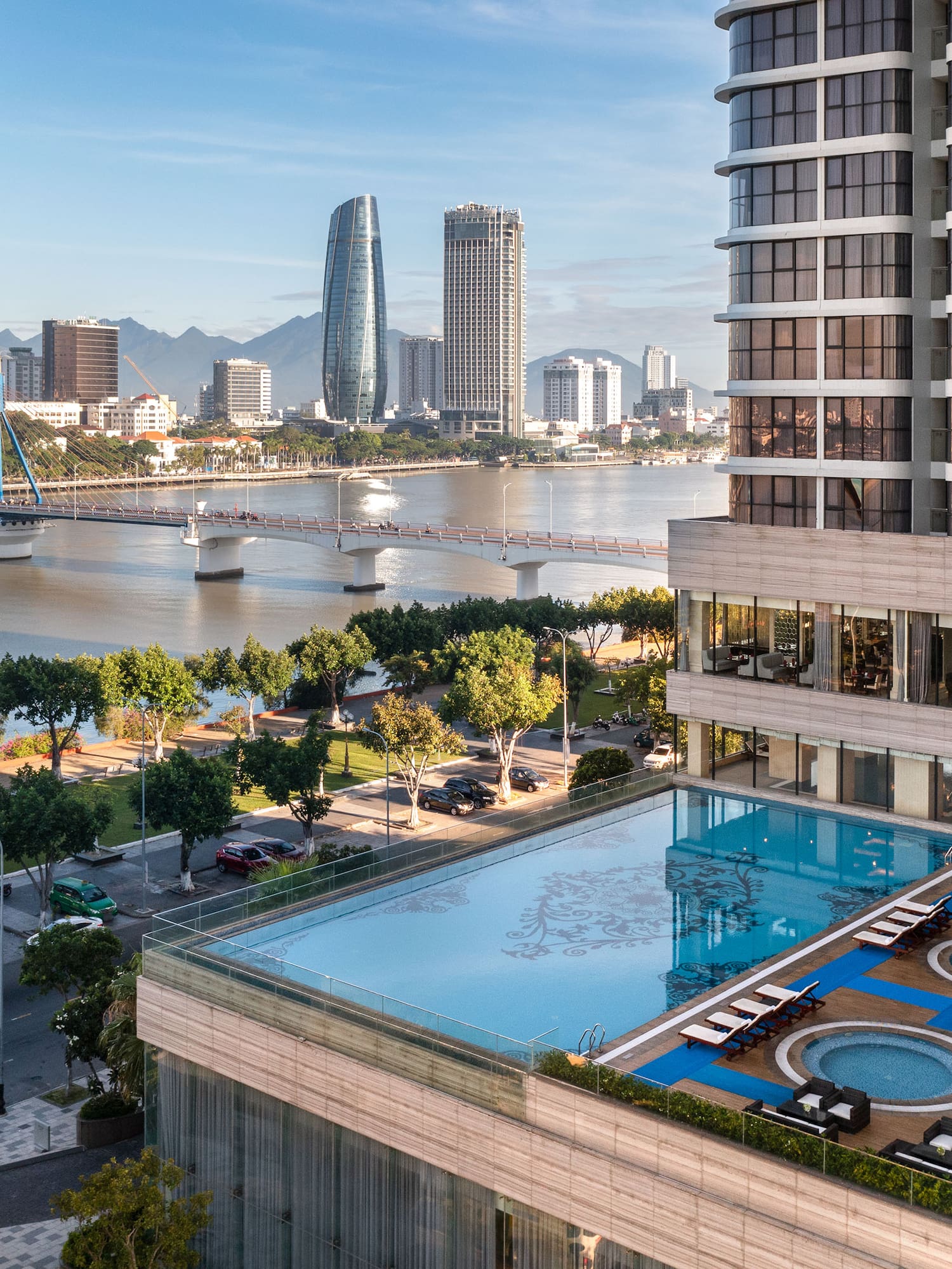 a pool in a building next to a body of water