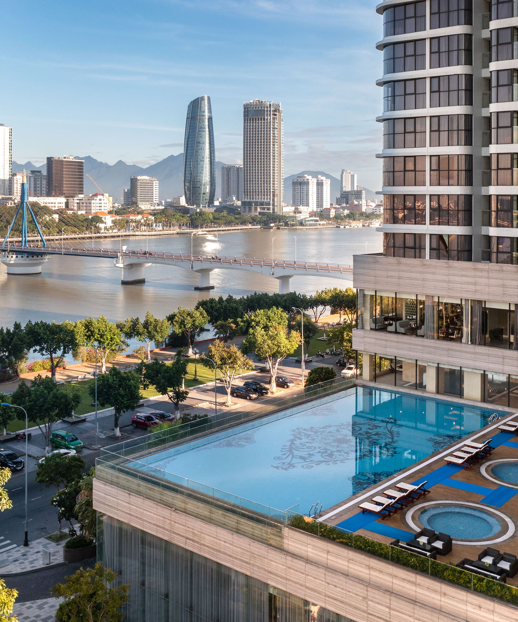 a pool in a building next to a body of water
