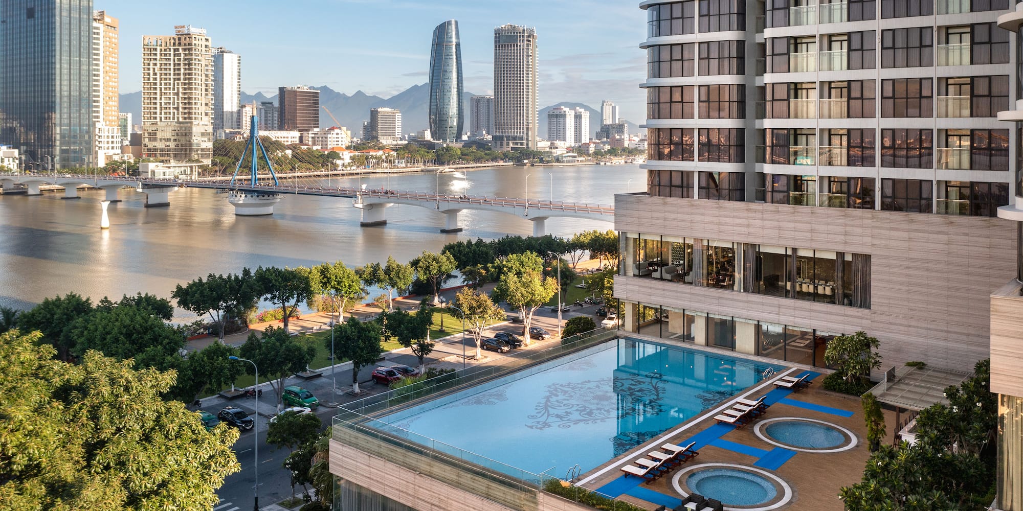 a pool in a building next to a body of water