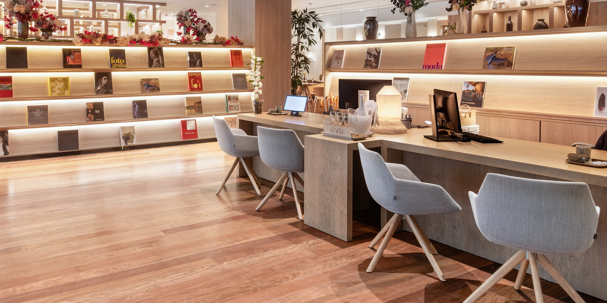 a room with a desk and chairs