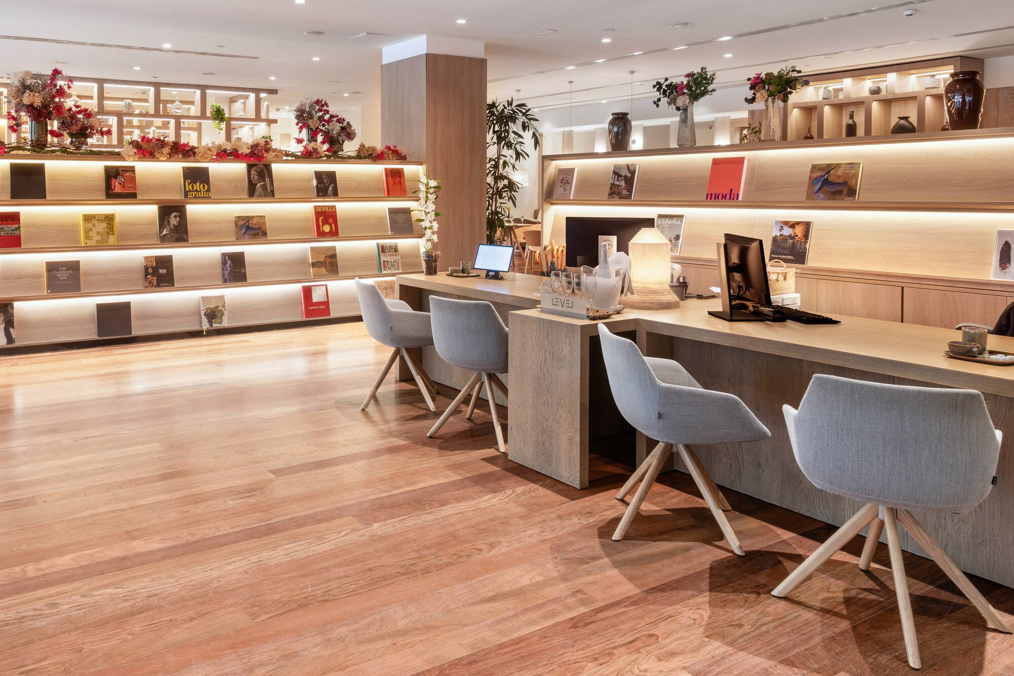 a room with a desk and chairs