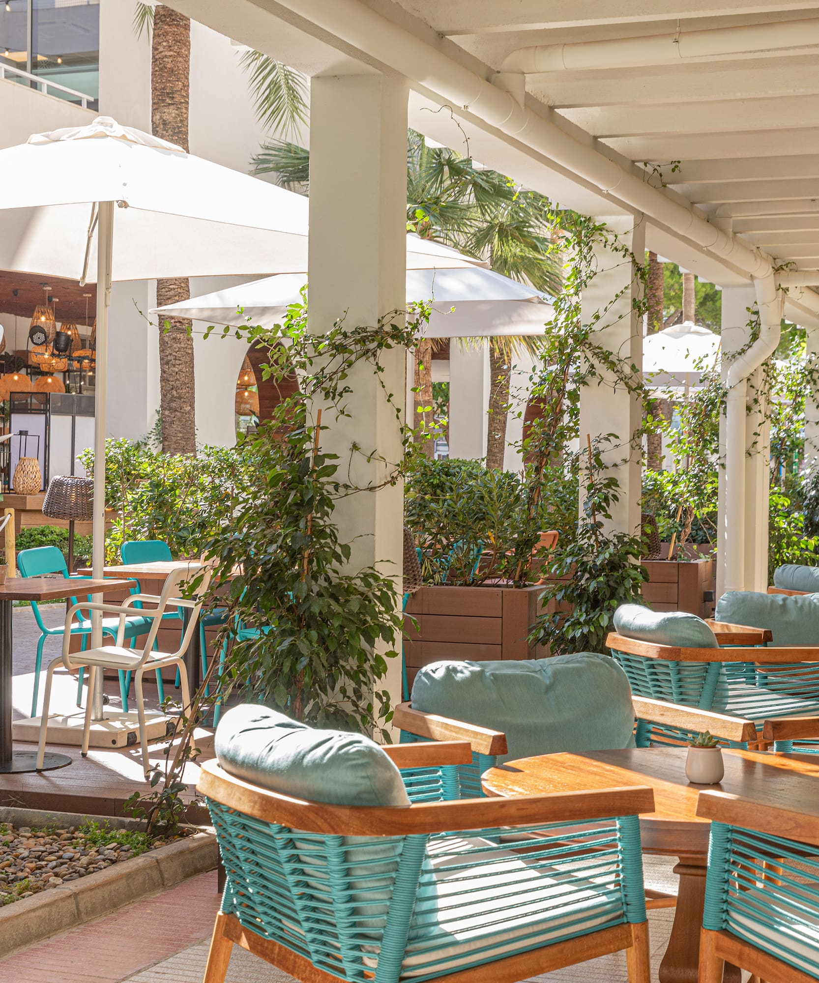 a patio with tables and chairs