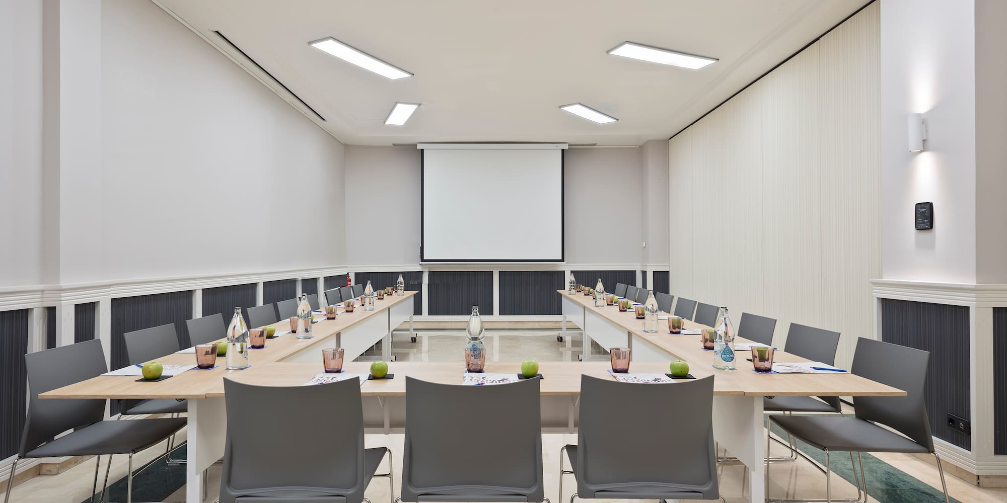 a room with a projection screen