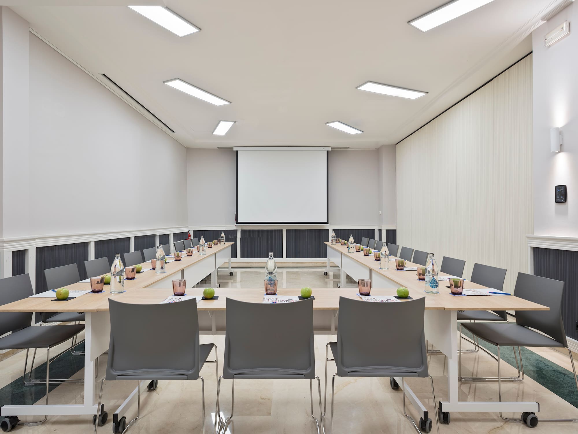 a room with a projection screen